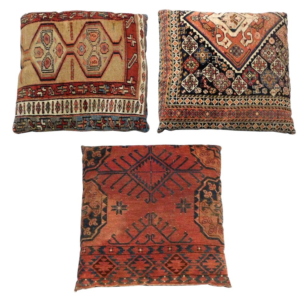 Appraisal: TEXTILES Three large rug fragment pillows assorted designs all with