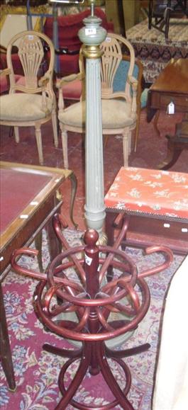 Appraisal: A green painted standard lamp and a part hat stand