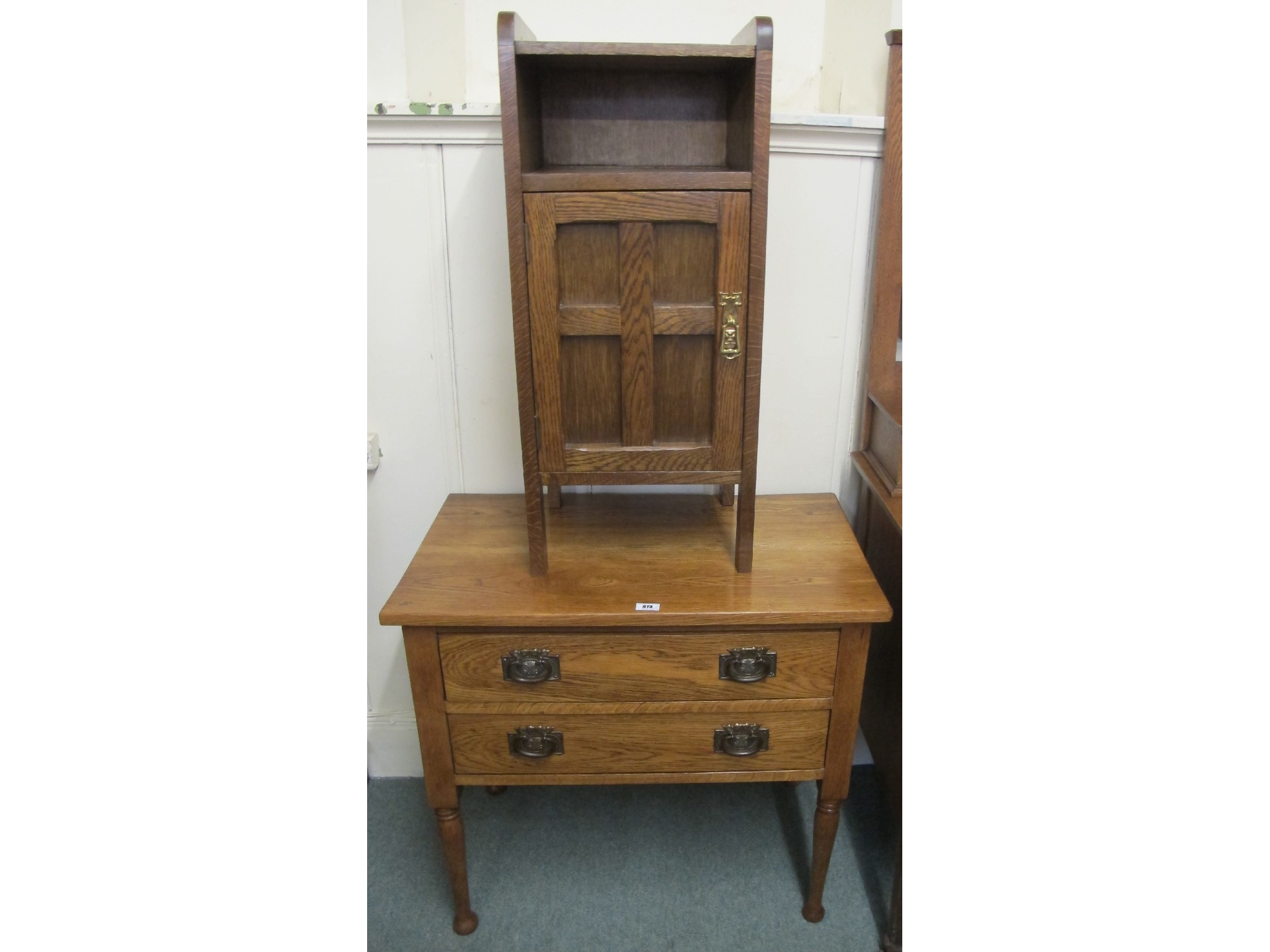 Appraisal: An Arts and Crafts oak two drawer chest and an