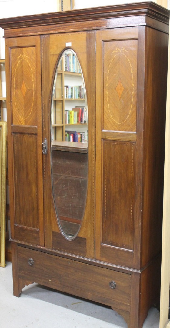 Appraisal: An Edwardian mahogany and boxwood strung single door wardrobe with