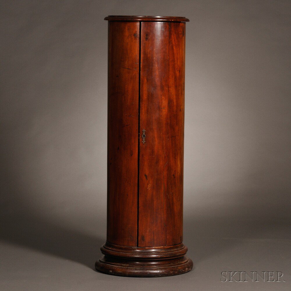 Appraisal: Cylindrical Mahogany Cabinet England th century the circular top with