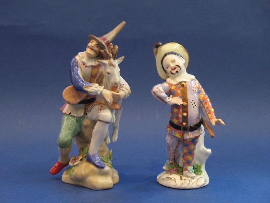 Appraisal: A VIENNA STYLE FIGURE OF A HARLEQUIN embracing a goat