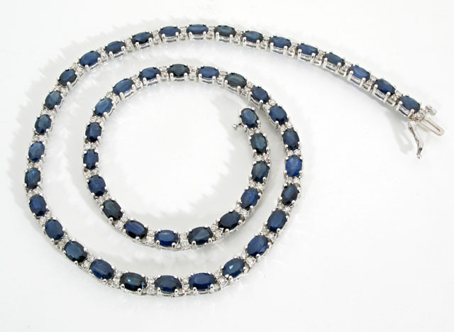 Appraisal: DIAMOND BLUE SAPPHIRE AND FOURTEEN KARAT WHITE GOLD RIVIERE NECKLACE