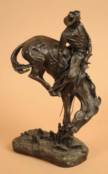 Appraisal: Bronze Cowboy Statue This statue depicts a cowboy riding a