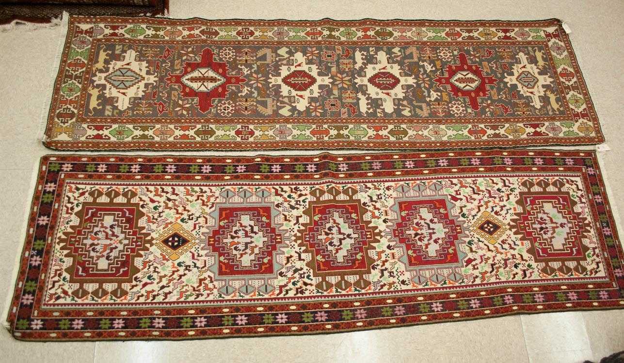 Appraisal: TWO PERSIAN SOUMAK FLATWEAVE RUNNERS hand woven with animal designs