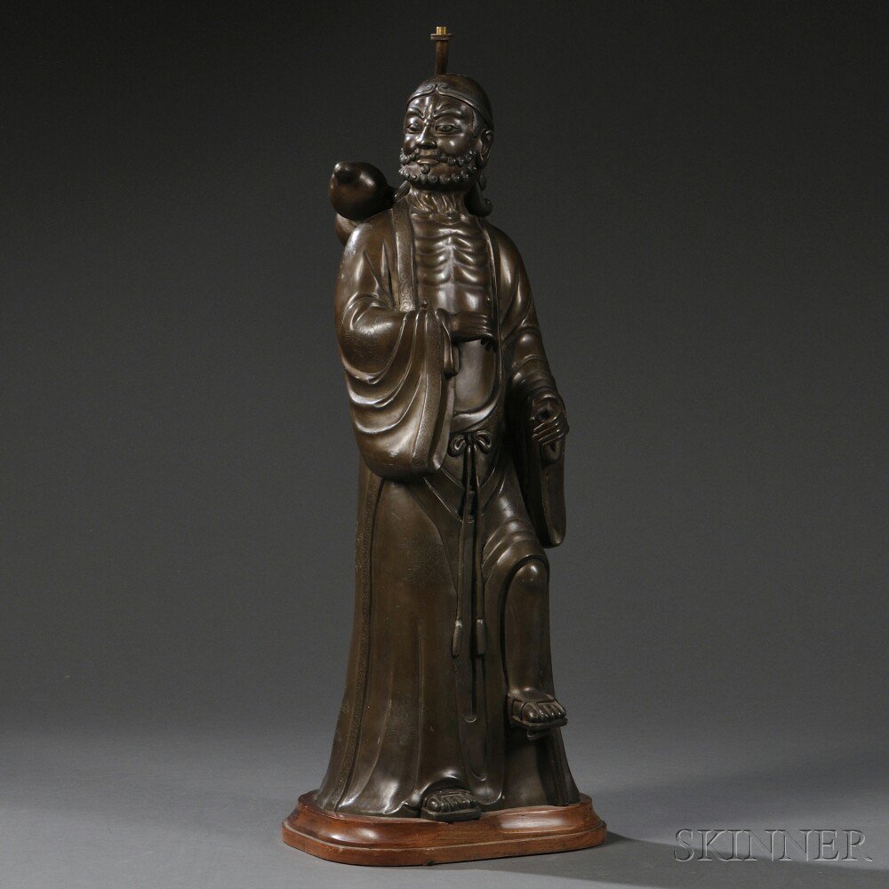 Appraisal: Metal Figure of a Monk China depicting a monk holding