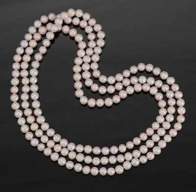 Appraisal: An Opera Length Strand of Pink Pearls Continuous necklace of