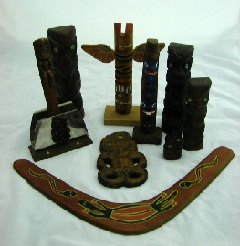 Appraisal: A collection of New Zealand Tikis together with a boomerang