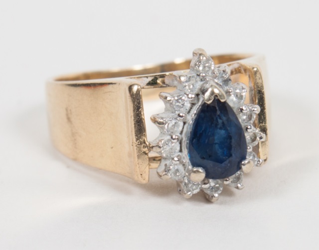 Appraisal: Lady's K gold diamond and sapphire ring centering a pear-shaped