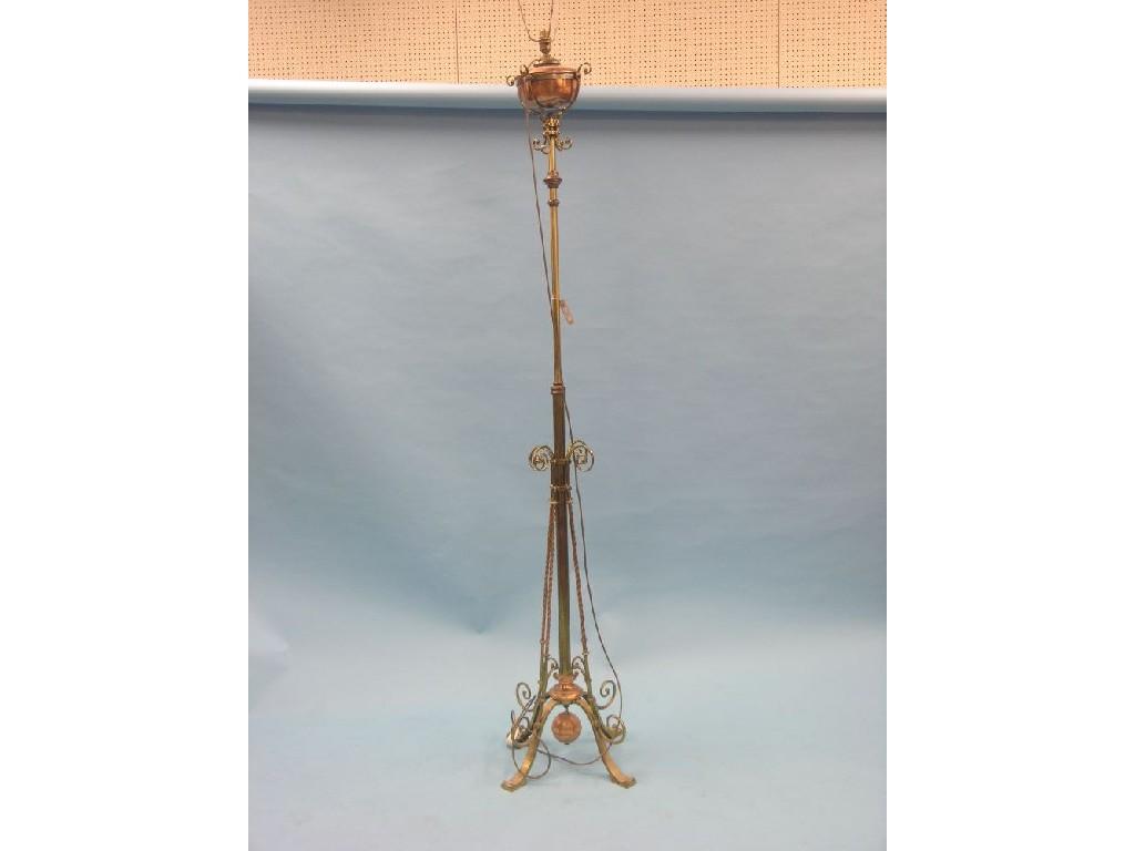 Appraisal: A Victorian brass floor-standing oil lamp with copper reservoir on