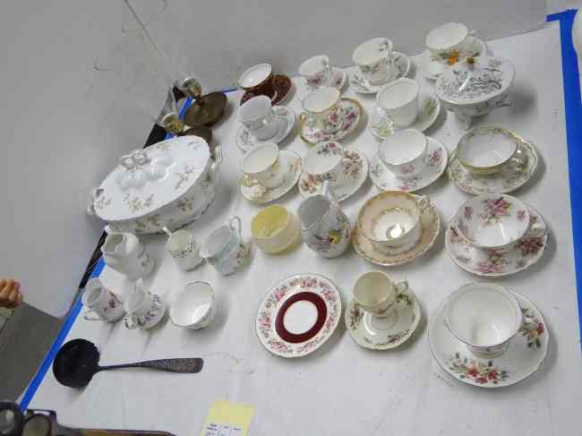 Appraisal: Lot misc teacups and saucers along with two hurricane lamps