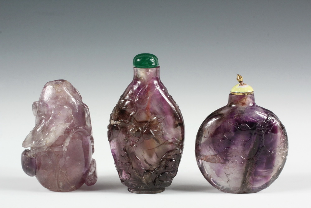 Appraisal: A GROUP OF AMETHYST SNUFF BOTTLES - Including A Carved