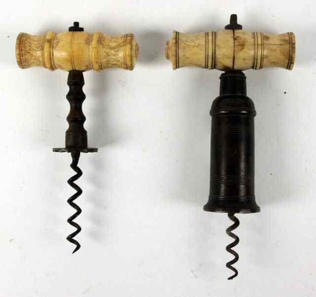 Appraisal: A brass corkscrew with turned ivory handle brush missing and