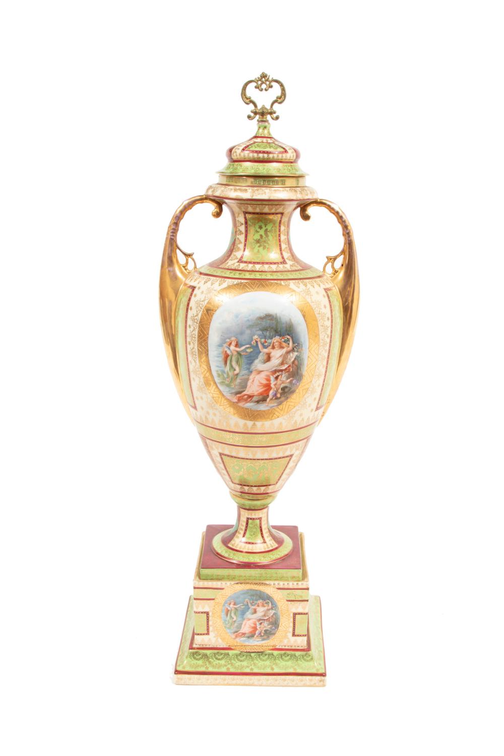 Appraisal: ROYAL VIENNA PORCELAIN COVERED URNRoyal Vienna Polychrome and Gilt Porcelain