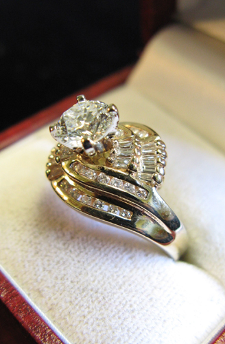 Appraisal: DIAMOND AND FOURTEEN KARAT GOLD RING centered and prong set