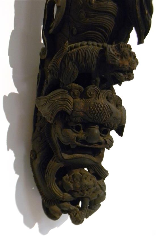 Appraisal: ASIAN Carved bas relief architectural post depicting two small Foo