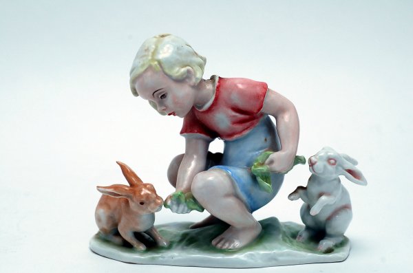 Appraisal: Rosenthal figurine depicting a small child feeding rabbits marked Rosenthal