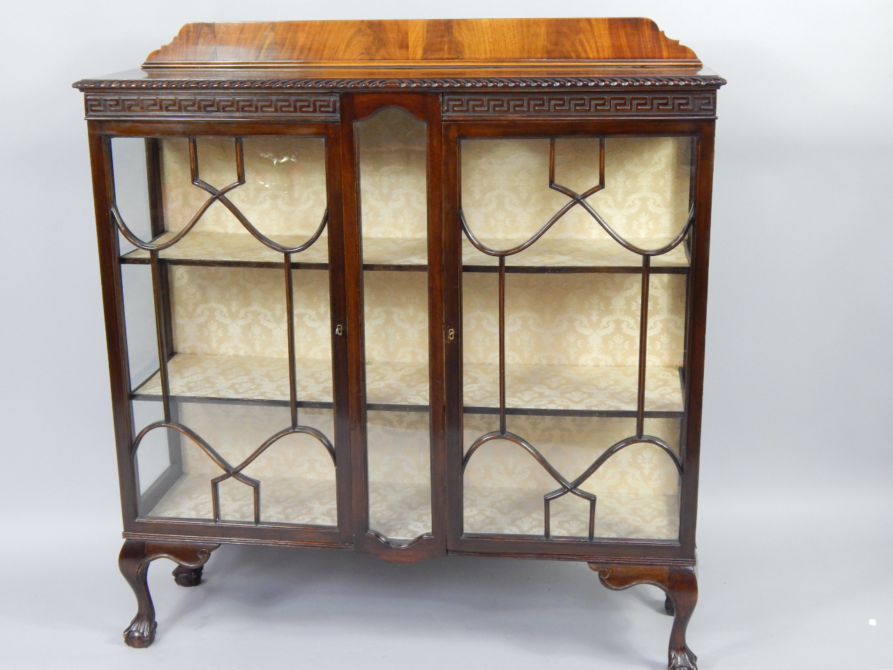 Appraisal: An early thC mahogany display cabinet with two astragal glazed