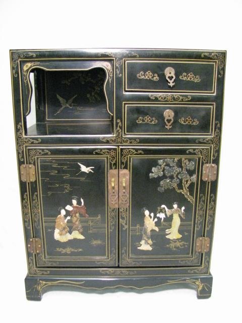 Appraisal: Chinese black lacquered chinoiserie two door two drawer cabinet with