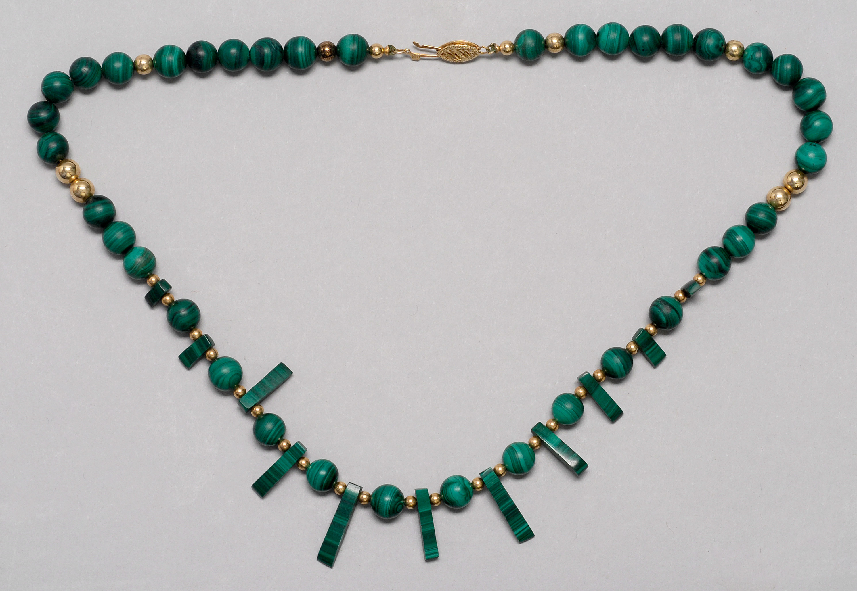 Appraisal: MALACHITE AND GOLD BEAD NECKLACE With approx mm malachite beads