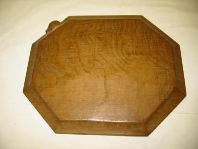 Appraisal: AN ADZED OAK CHOPPING BOARD by Robert Mouseman Thompson of