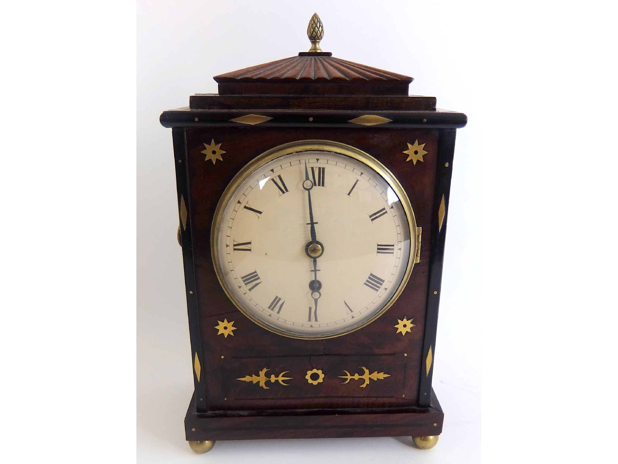 Appraisal: A Regency mahogany and brass inlaid mantle clockwith pine cone