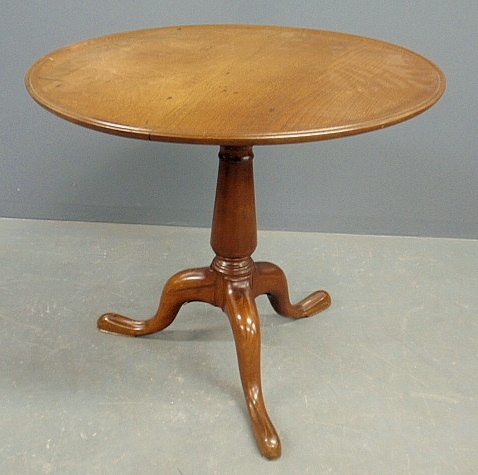 Appraisal: - English Queen Anne mahogany tea table with a circular