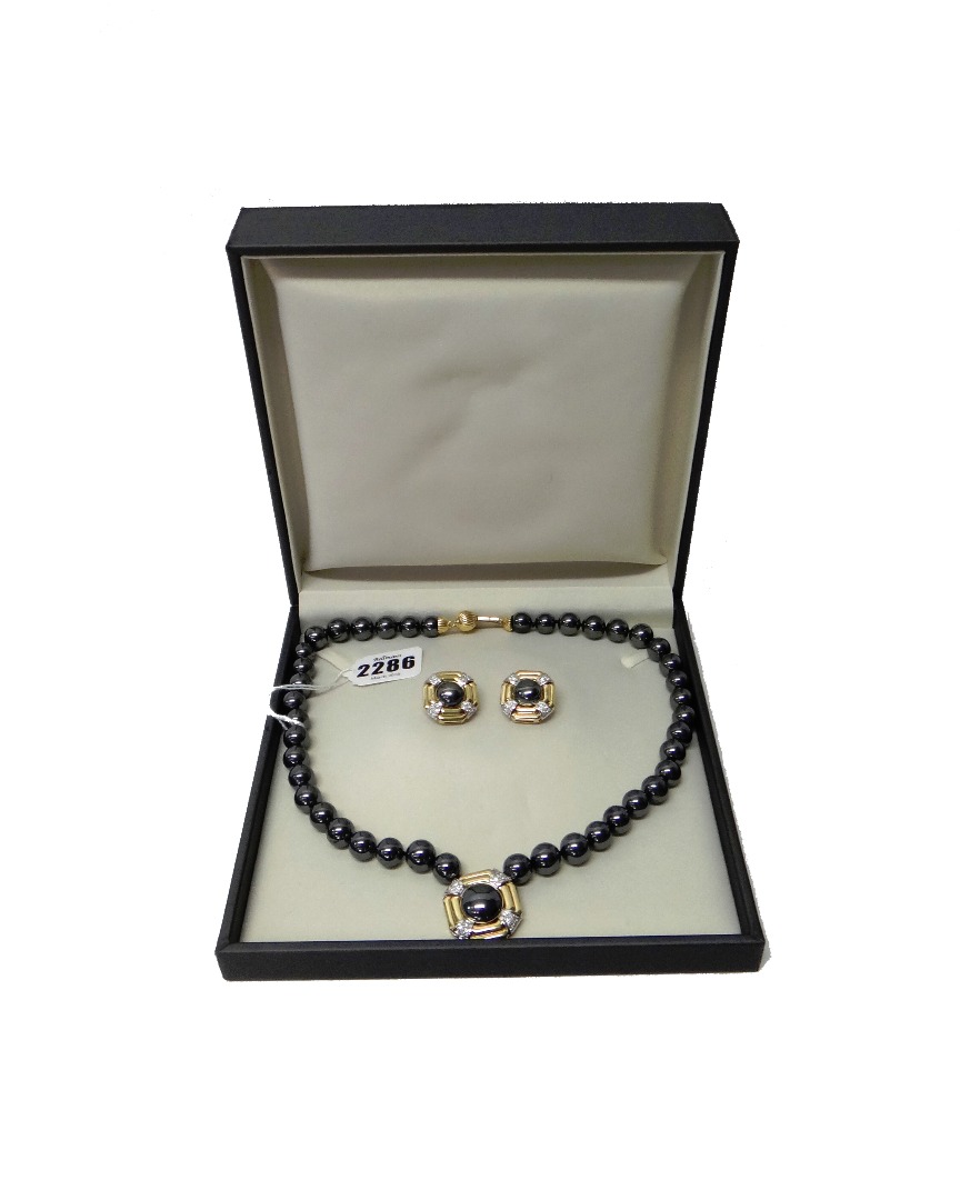 Appraisal: A gold diamond and haematite necklace formed as a single