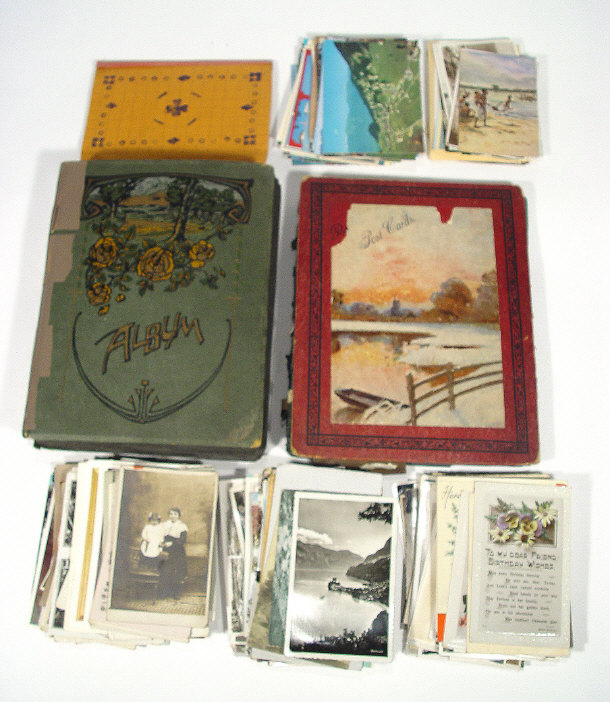 Appraisal: Extensive collection of postcards including two Edwardian albums black and