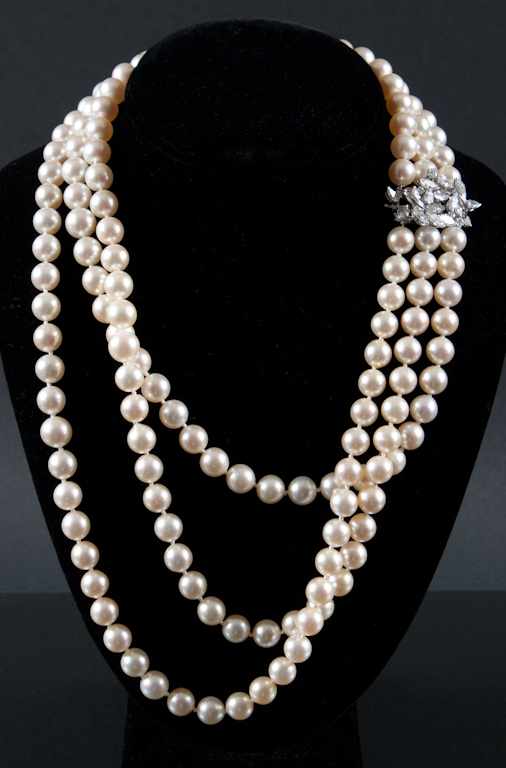 Appraisal: Lady's multi-strand cultured pearl necklace decorated with a platinum and