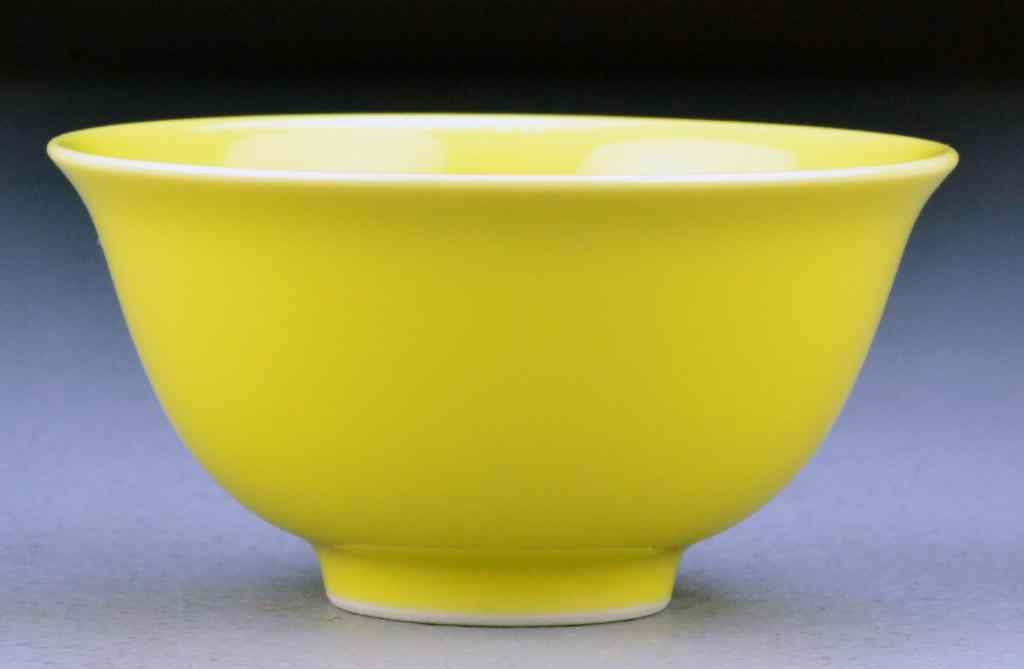 Appraisal: Chinese Qing Lemon Yellow Porcelain BowlWith slightly flaring rim raised