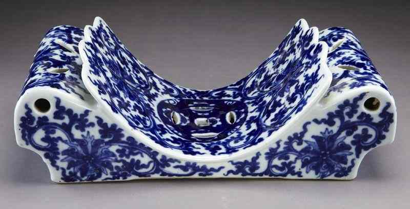 Appraisal: Chinese Qing blue and white porcelain pillowdepicting lotus and coins