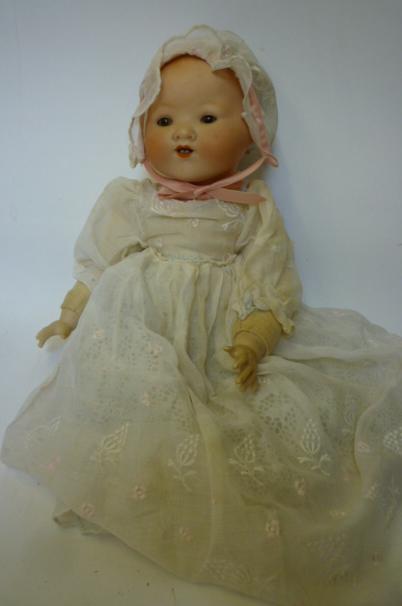 Appraisal: An Armand Marseille bisque head baby doll with brown glass