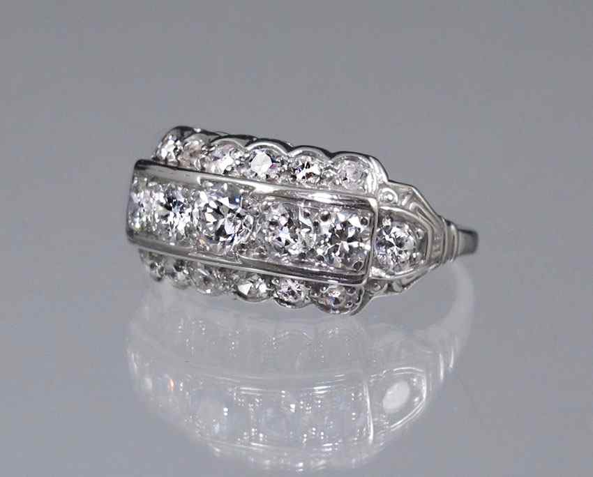 Appraisal: PLATINUM THREE ROW DIAMOND RING Platinum retro Deco ring contains