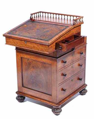 Appraisal: A GEORGE IV HONDURAS MAHOGANY DAVENPORT DESK the sliding galleried