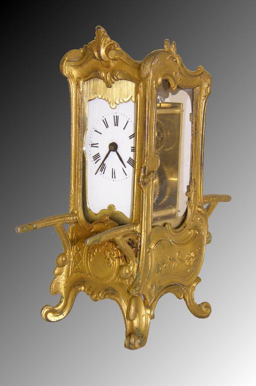 Appraisal: Novelty gilt metal sedan chair carriage timepiece the movement back