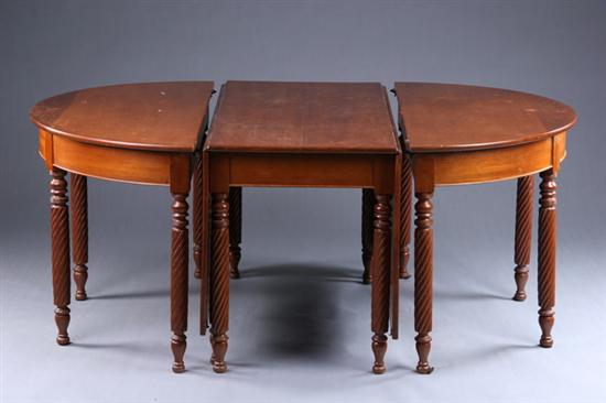 Appraisal: AMERICAN CLASSICAL THREE-PART DINING TABLE th century walnut Drop-leaf center