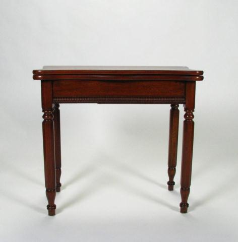 Appraisal: Walnut turn-top game table with reeded legs scalloped-edge top th