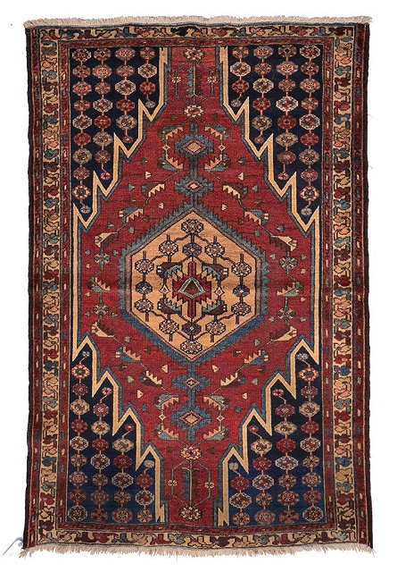 Appraisal: AN OLD PERSIAN BLOOD RED GROUND RUG with a central