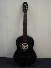 Appraisal: A guitar with rosewood fingerboard and ceramic tuning peg grips