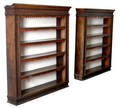 Appraisal: A pair of Anglo-Indian teak open bookcases with surrounds carved