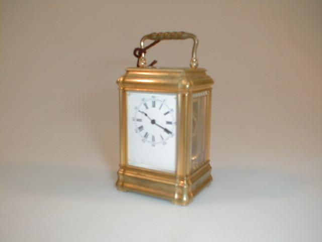 Appraisal: A miniature gilt brass carriage timepiece