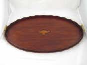 Appraisal: A two handled large oval mahogany galleried tray with central