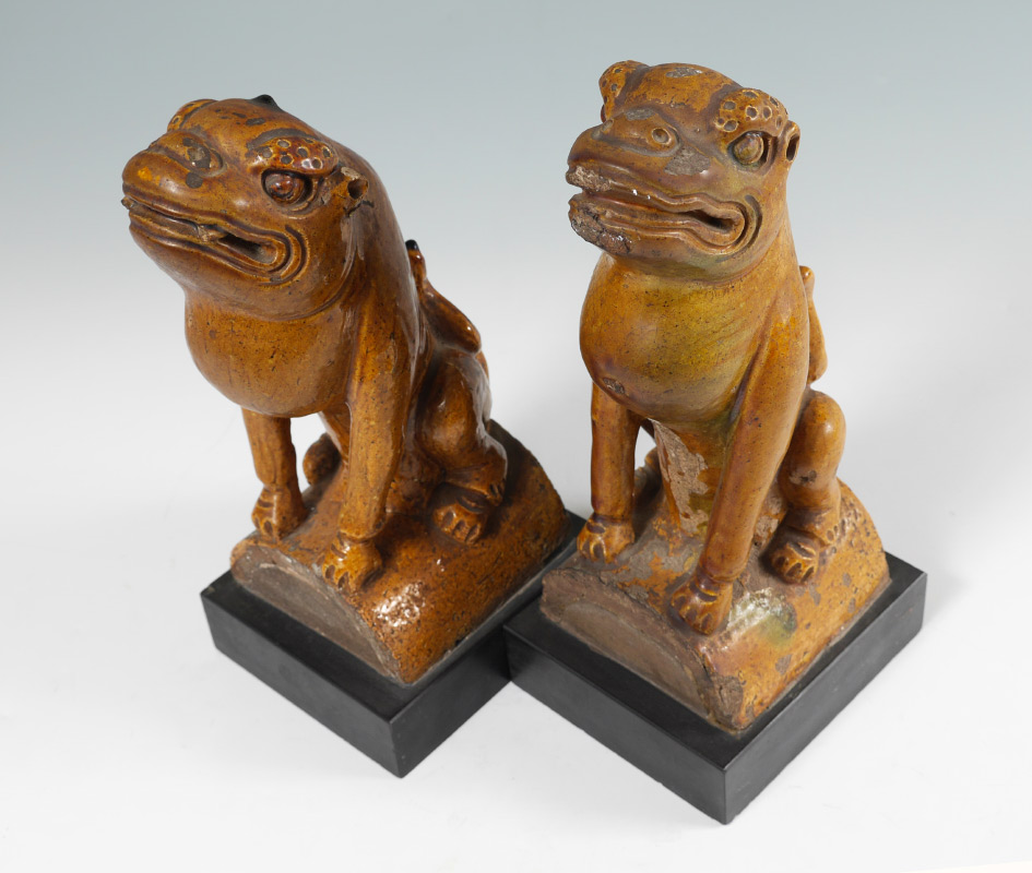 Appraisal: PAIR CHINESE GLAZED TEMPLE LION ROOF TILES Figural seated temple