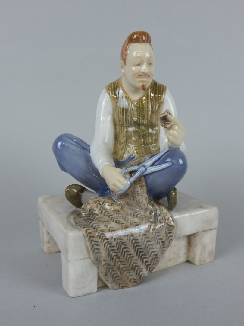 Appraisal: A Bing Grondahl porcelain figure of a tailor seated on