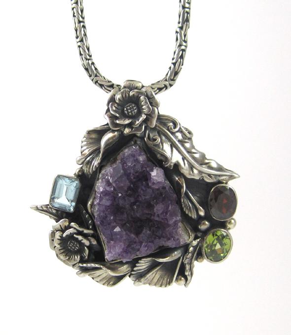 Appraisal: AMETHYST AND STERLING SILVER PENDANT NECKLACE suspended on a inch