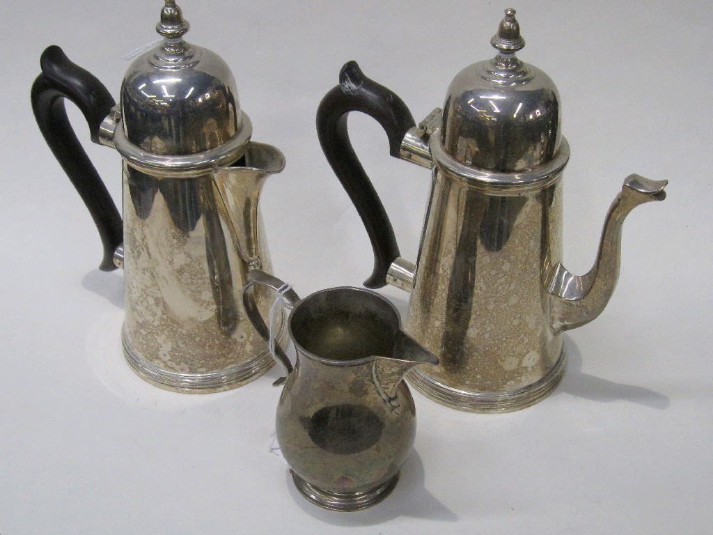 Appraisal: Two silver chocolate pots Birmingham and a silver jug Birmingham