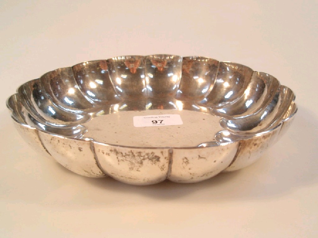 Appraisal: A modern silver circular dish with lobed border by Richard