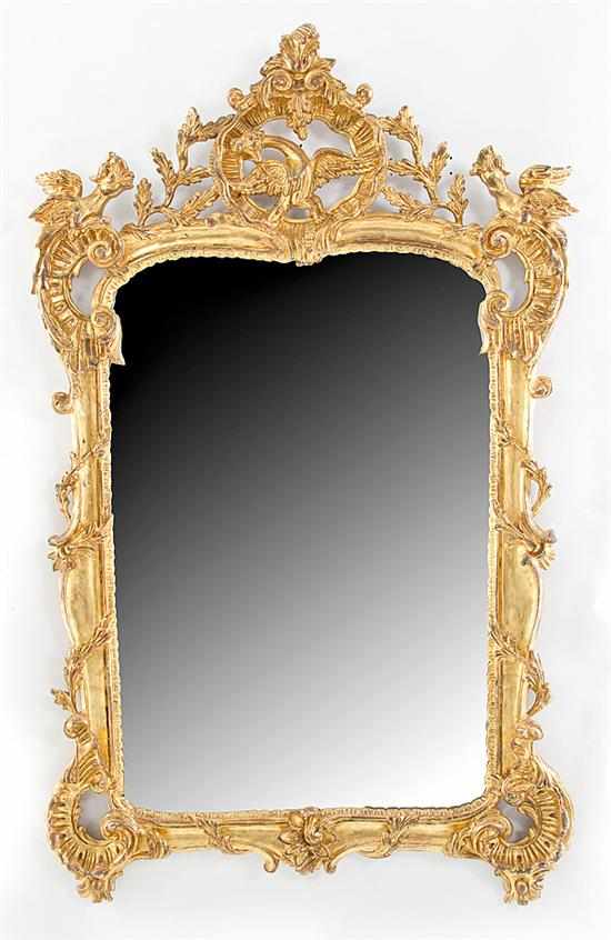 Appraisal: Rococo style giltwood and gesso mirror open shell with phoenix