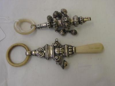 Appraisal: A BABY'S RATTLE with mother of pearl teething ring and